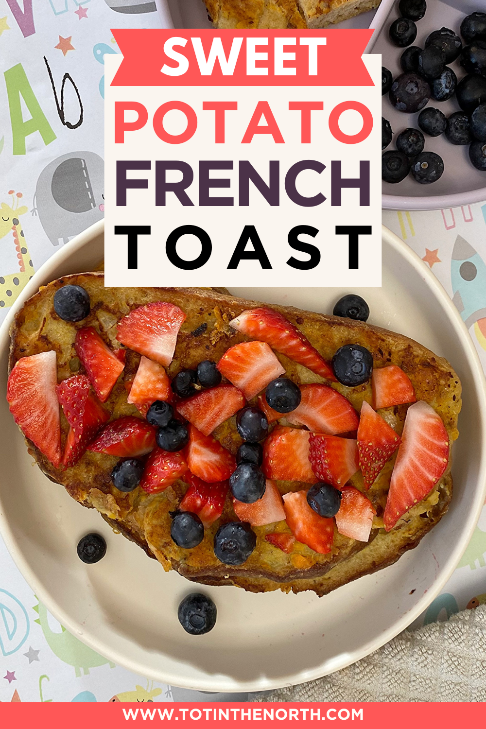 Sweet potato French Toast in a plate served with strawberries and blueberries on top. 