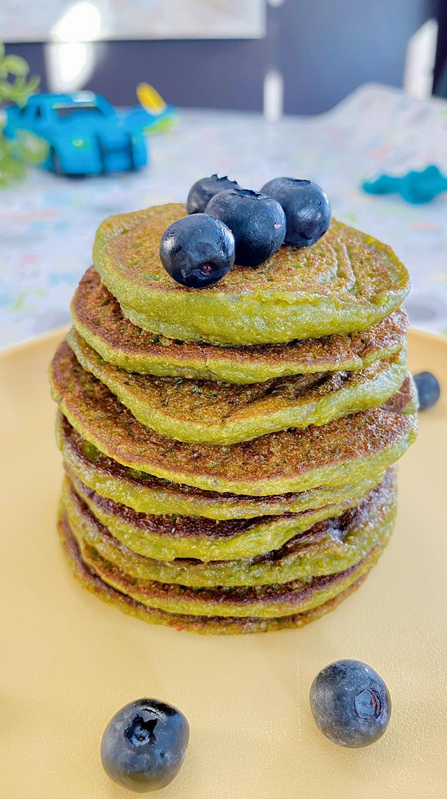 Stack of fluffy spinach banana pancakes for babies and toddlers, a healthy iron-rich breakfast made with spinach and banana, naturally sweet with no added sugar.