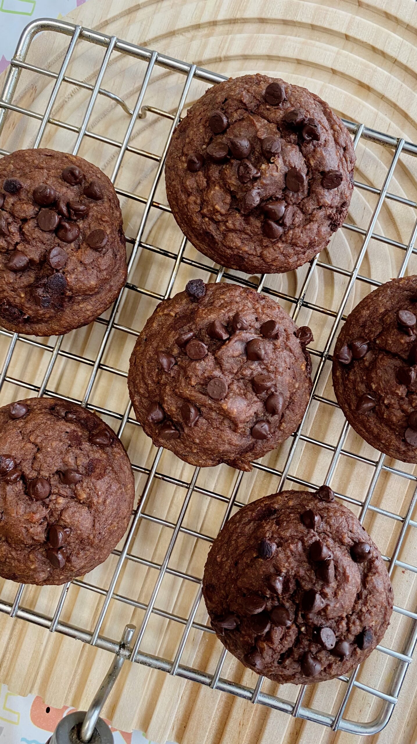 Freshly baked beetroot choco muffins on a cooling rack